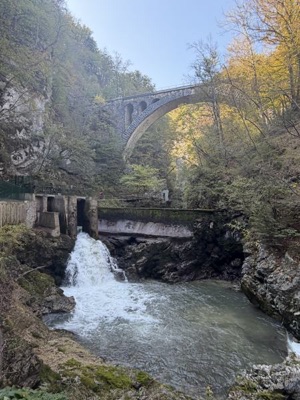 Waterfall beneath the stone railway bridge in Vintgar Gorge