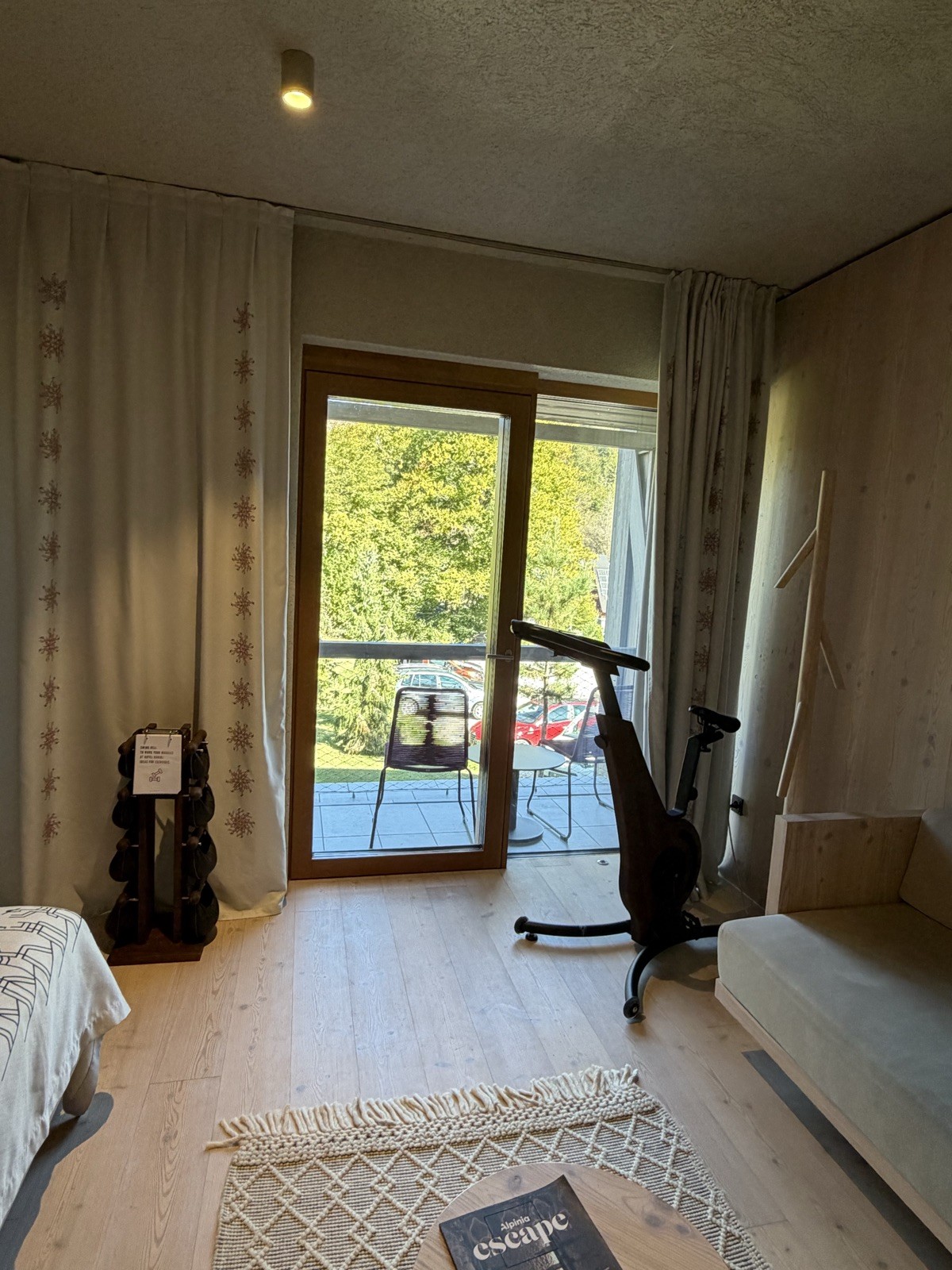 Guest room with a stationary bike at Hotel Bohinj