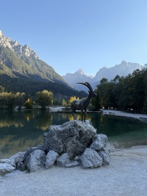 Ibex statue at Lake Jasna with the Julian Alps behind
