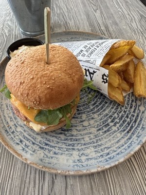 Veggie burger on a gluten-free bun with fries at Felix in Bovec