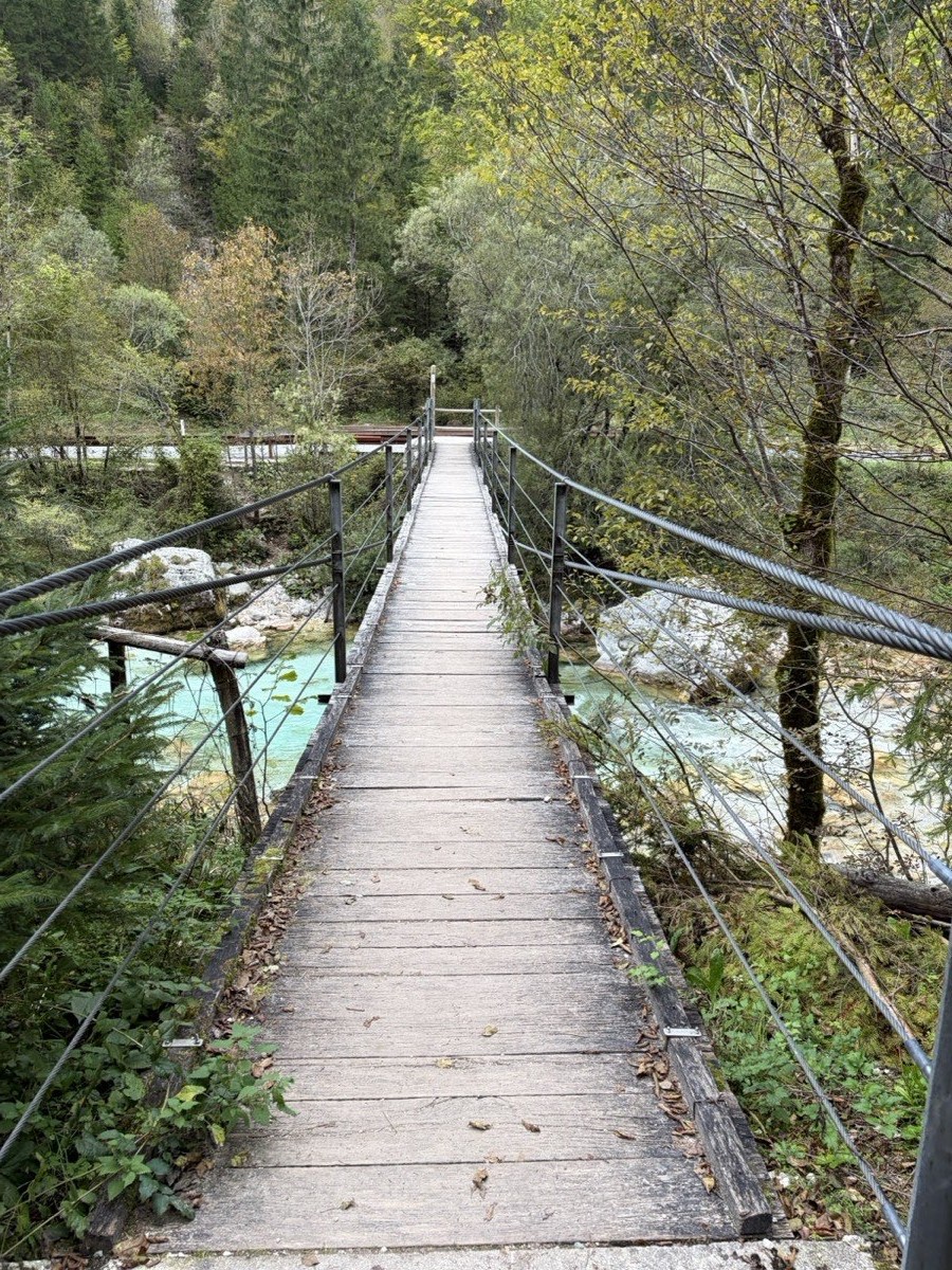 Wooden suspension footbridge over the Soča