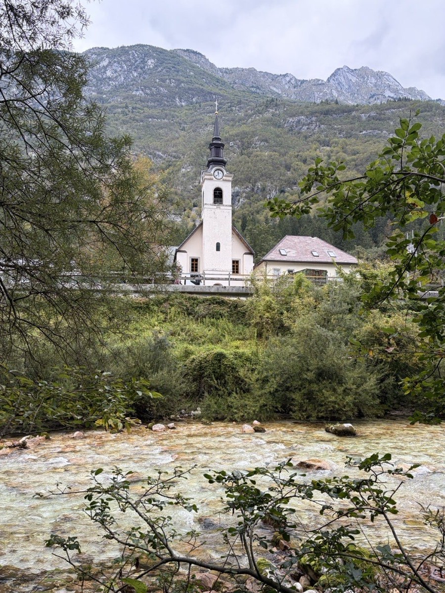 The white church in Soča village above the river